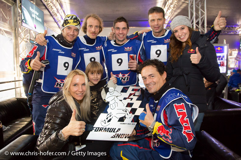 SAALBACH-HINTERGLEMM, AUSTRIA - DECEMBER 05:   KINI Red Bull team members (standing) Timo Scheider, Simo Kirssi, Ben Hemingway, Andi Meklau and Kris Rosenberger with wife Ursula and Son Ben during the third and final day of the Formula Snow 2015 ski opening on December 5, 2015 in Saalbach-Hinterglemm, Austria.  (Photo by Chris Hofer/Getty Images)